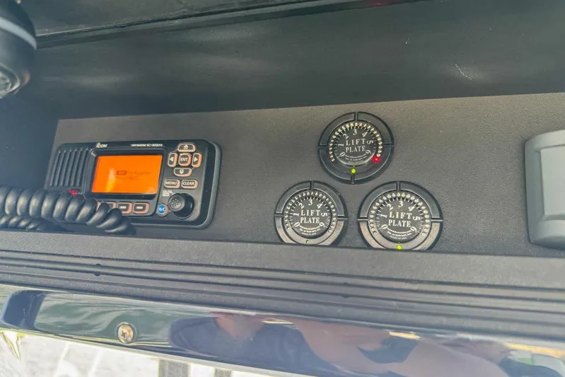  Yacht Photos Pics Control panel of 2018 Statement 380 Open with radio and lift plate gauges.