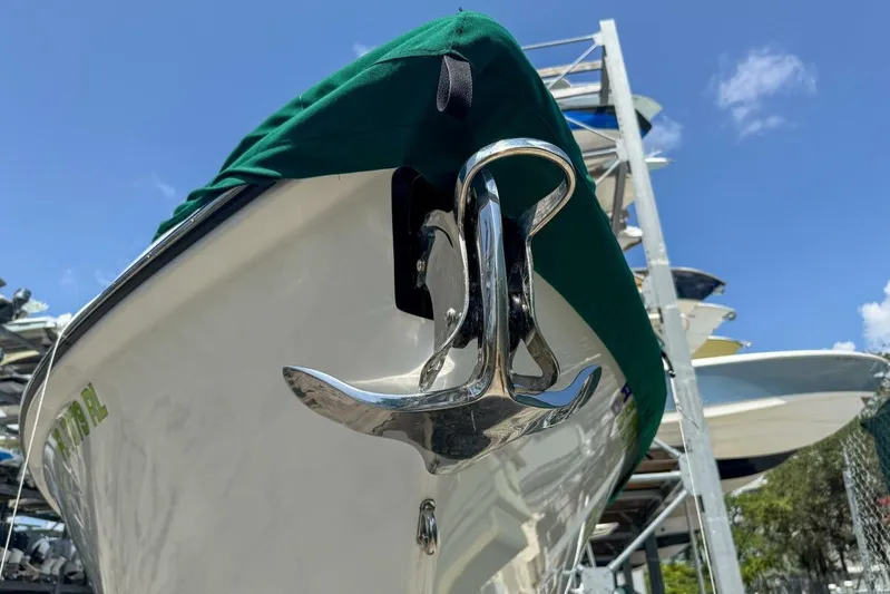  Yacht Photos Pics 2018 Statement 380 Open boat with anchor, covered and docked under clear blue sky.