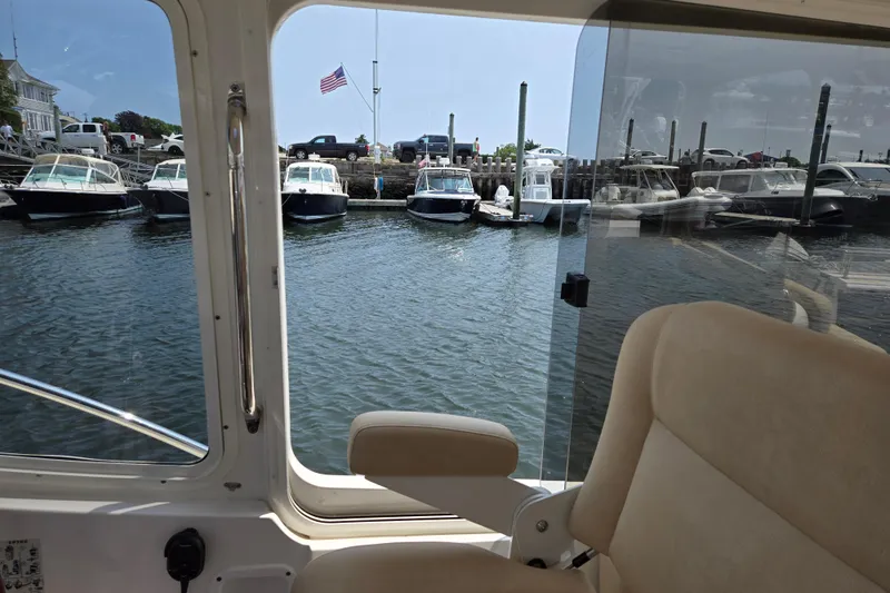 Eagle Wing Yacht Photos Pics Interior view from 2017 MJM 40z Downeast boat, overlooking marina with docked boats.