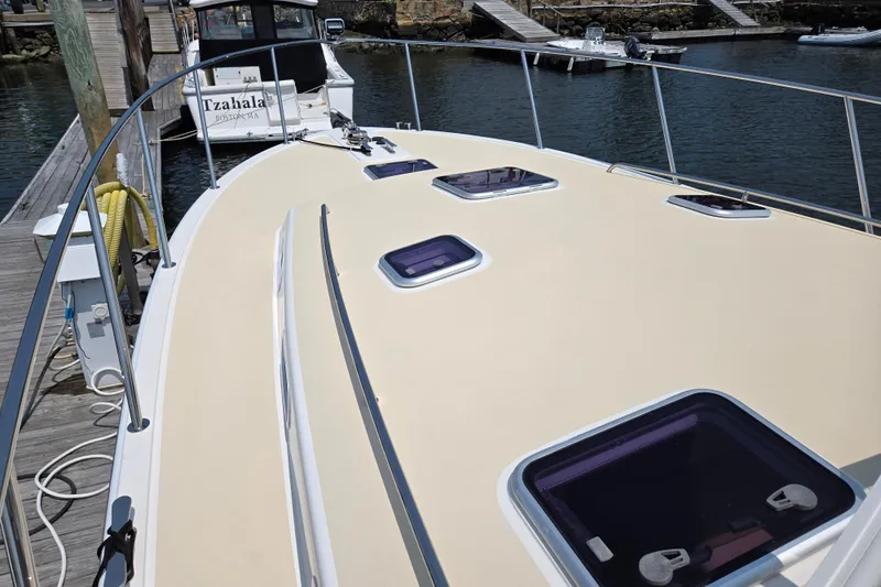 Eagle Wing Yacht Photos Pics 2017 MJM 40z Downeast boat docked, showcasing deck and hatches.