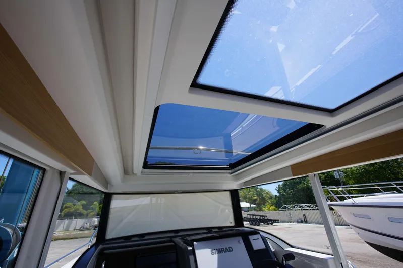 In-stock 2024 Nimbus C9 #158 Yacht Photos Pics Interior view of 2024 Nimbus Commuter 9 #158 with panoramic sunroof.