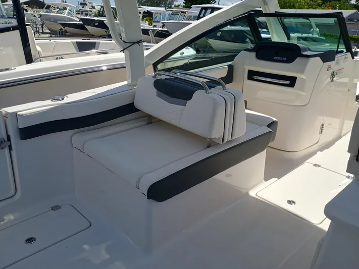 257-155 Yacht Photos Pics 2025 Robalo R257 Dual Console interior with white seating and modern design.