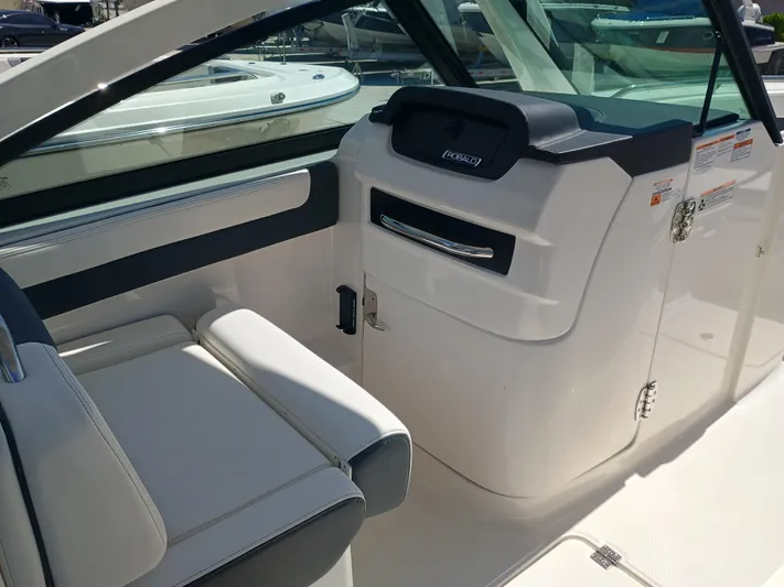 257-155 Yacht Photos Pics 2025 Robalo R257 Dual Console interior with seating and storage compartment.