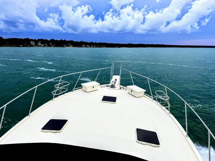 Sunshine State Yacht Photos Pics Viking 48 Motoryacht 1987 on open water under blue sky.