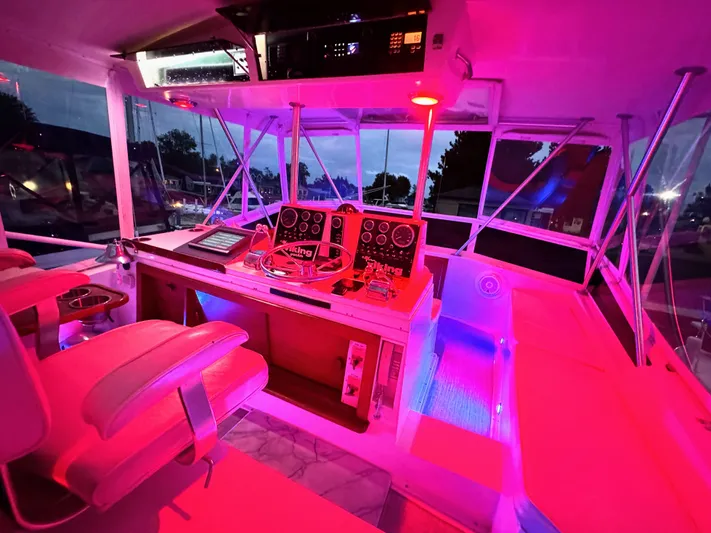 Sunshine State Yacht Photos Pics Illuminated cockpit of a 1987 Viking 48 Motoryacht at night.