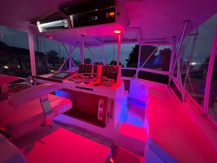 Sunshine State Yacht Photos Pics Illuminated cockpit of 1987 Viking 48 Motoryacht at night.