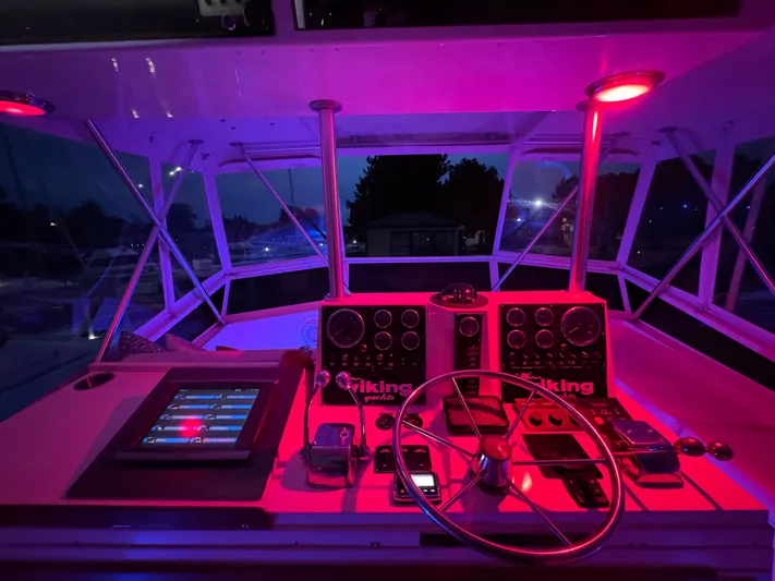 Sunshine State Yacht Photos Pics Illuminated cockpit of 1987 Viking 48 Motoryacht at night.