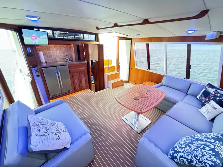 Sunshine State Yacht Photos Pics Interior of 1987 Viking 48 Motoryacht with sofa and table.