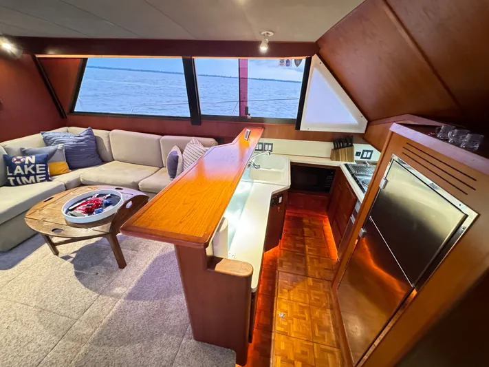 Sunshine State Yacht Photos Pics Interior of 1987 Viking 48 Motoryacht with kitchen and seating area.