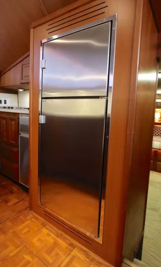 Sunshine State Yacht Photos Pics Stainless steel refrigerator in a 1987 Viking 48 Motoryacht.
