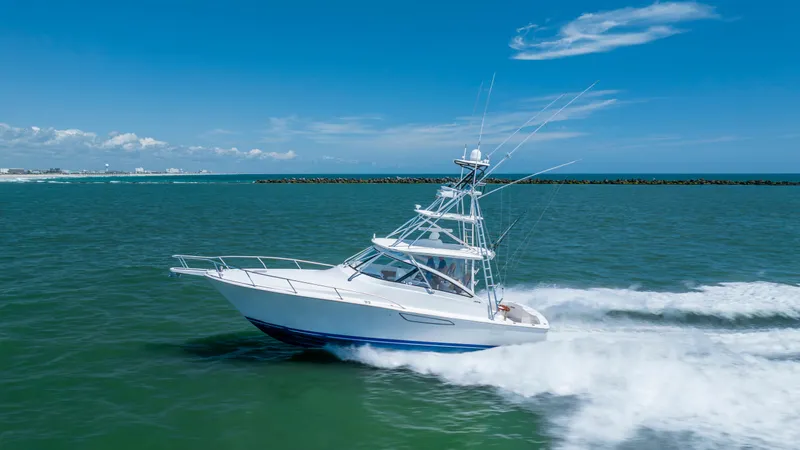 Life Is Good Yacht Photos Pics 2013 Viking 42 yacht cruising on open sea under clear blue sky.