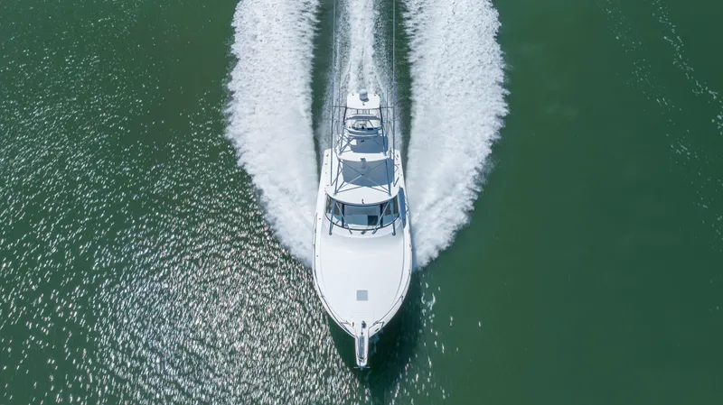 Life Is Good Yacht Photos Pics Aerial view of 2013 Viking 42 yacht cruising on open water.
