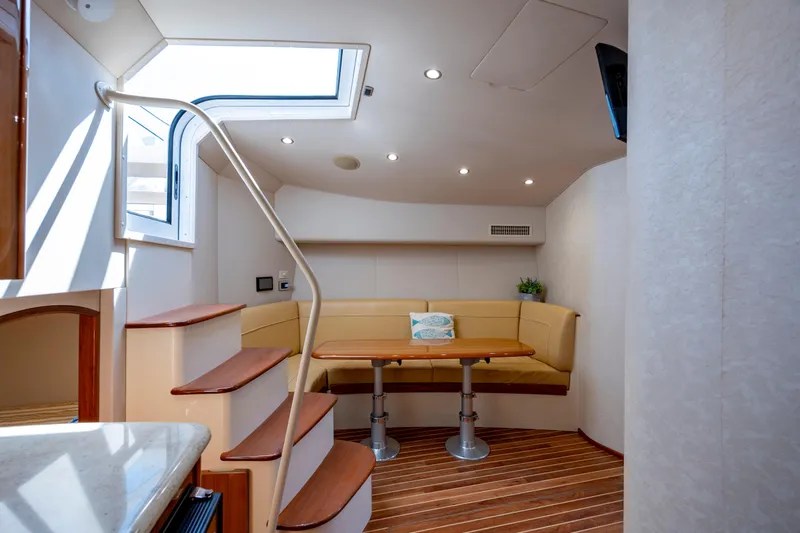 Life Is Good Yacht Photos Pics Interior of 2013 Viking 42 yacht with cozy seating and wooden flooring.