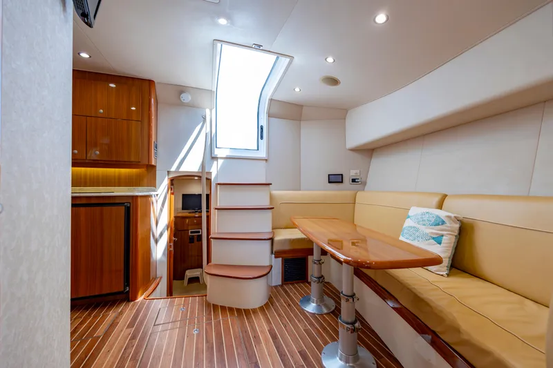 Life Is Good Yacht Photos Pics Luxurious interior of 2013 Viking 42 yacht with elegant seating and wooden finishes.