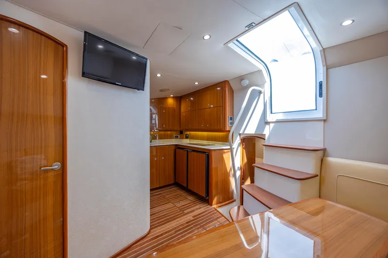 Life Is Good Yacht Photos Pics Luxurious interior of 2013 Viking 42 yacht with wooden cabinetry and modern amenities.