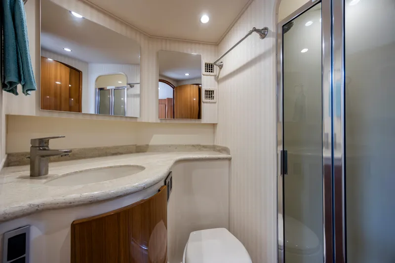 Life Is Good Yacht Photos Pics Luxurious bathroom in a 2013 Viking 42 yacht, featuring modern fixtures and elegant design.