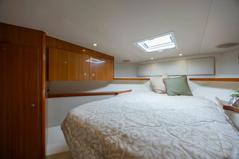 Life Is Good Yacht Photos Pics Luxurious cabin interior of 2013 Viking 42 yacht with skylight and elegant bedding.