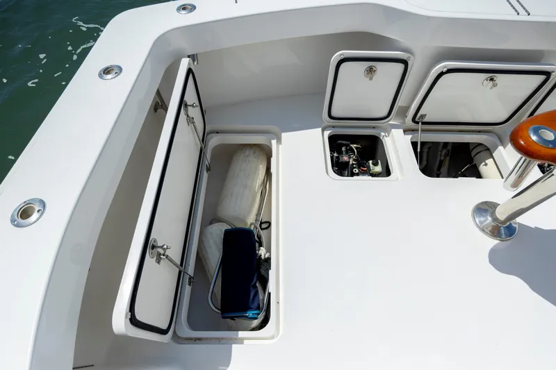 Life Is Good Yacht Photos Pics 2013 Viking 42 boat deck with open storage compartments and visible equipment.