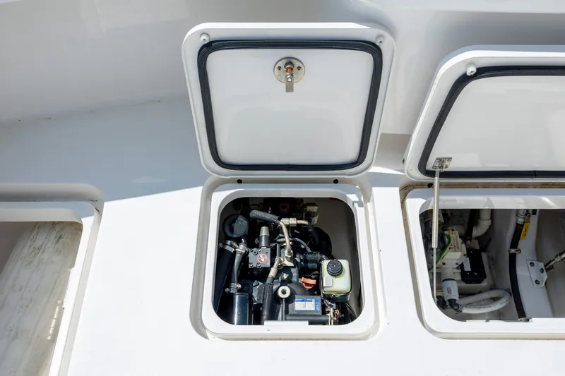 Life Is Good Yacht Photos Pics Open engine compartment of 2013 Viking 42 boat, showcasing mechanical components.