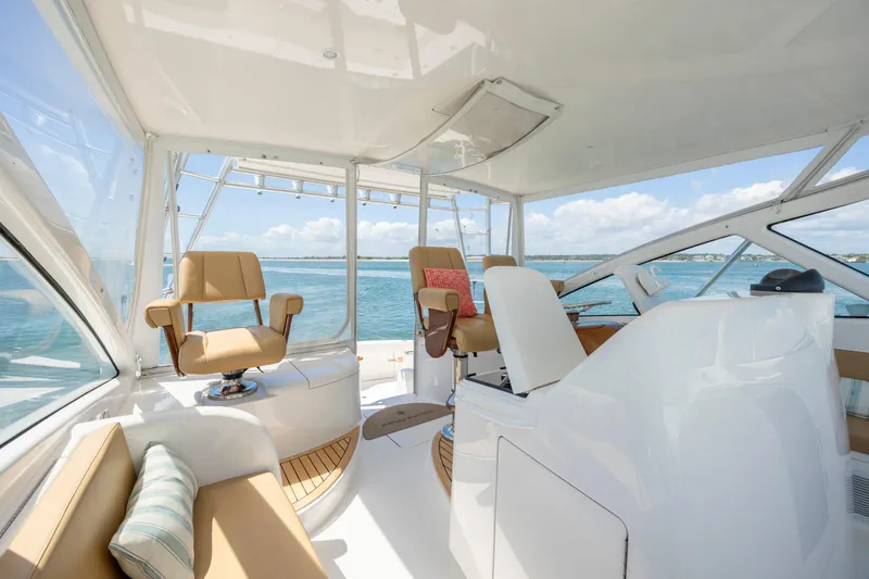 Life Is Good Yacht Photos Pics Luxurious 2013 Viking 42 yacht interior with ocean view, featuring comfortable seating and modern design.