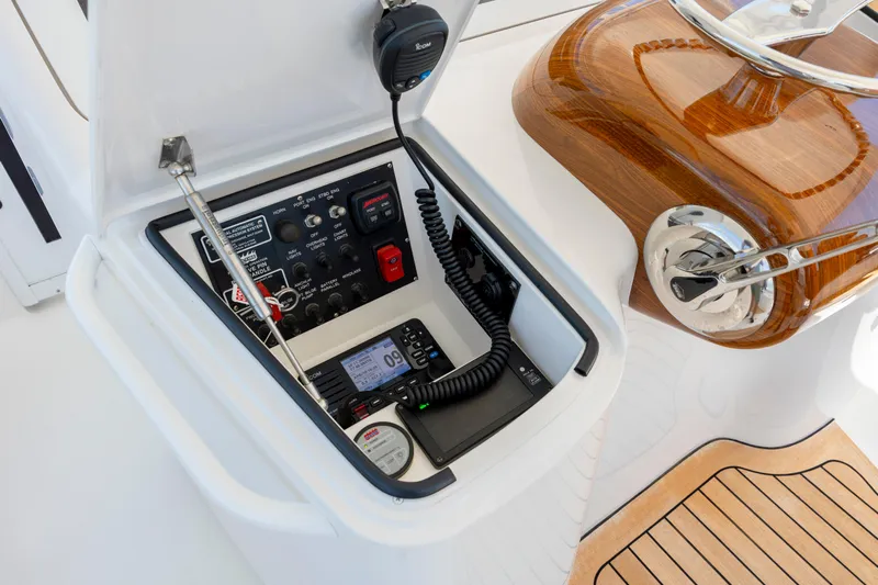 Life Is Good Yacht Photos Pics Control panel of a 2013 Viking 42 yacht with communication equipment and wooden accents.