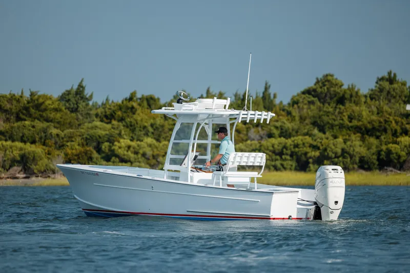  Yacht Photos Pics 2019 Gamefisherman 26 Cuddy Cabin boat cruising on water.