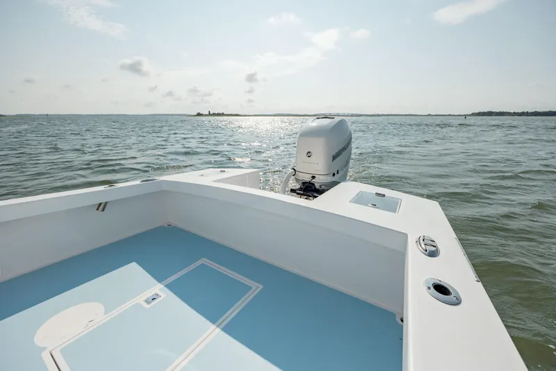  Yacht Photos Pics 2019 Gamefisherman 26 Cuddy Cabin boat on open water with outboard motor.