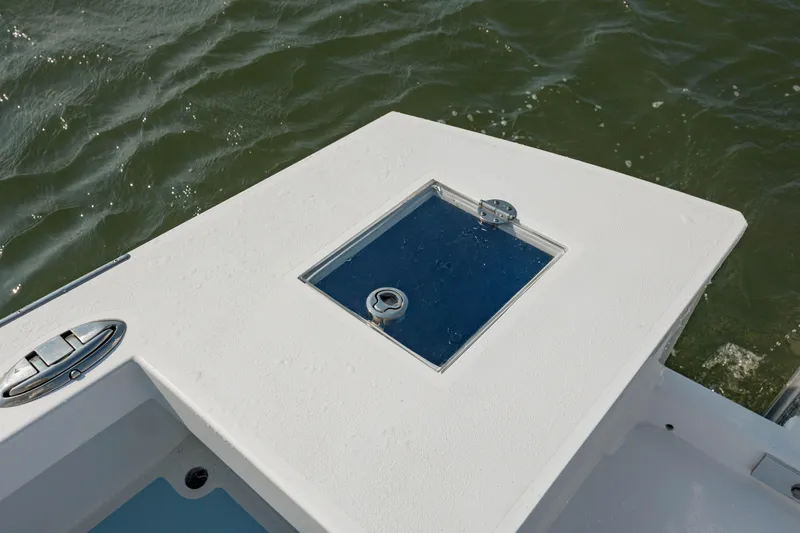  Yacht Photos Pics 2019 Gamefisherman 26 Cuddy Cabin boat deck with hatch, on water.