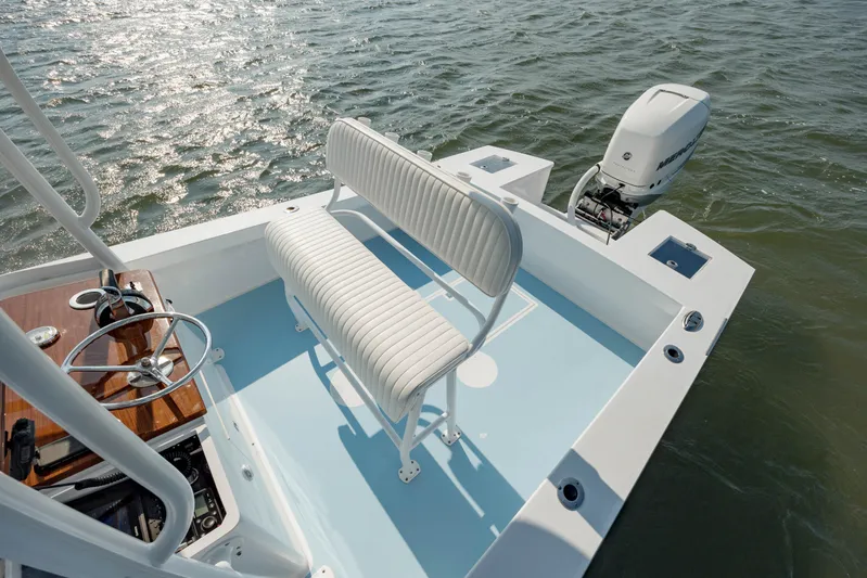  Yacht Photos Pics 2019 Gamefisherman 26 Cuddy Cabin boat, rear deck view with seating and outboard motor.