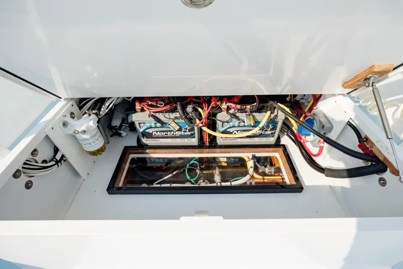  Yacht Photos Pics 2019 Gamefisherman 26 Cuddy Cabin engine compartment with batteries and wiring.