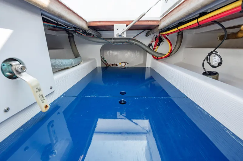  Yacht Photos Pics 2019 Gamefisherman 26 Cuddy Cabin interior with blue flooring and visible wiring.