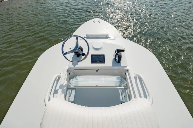  Yacht Photos Pics 2019 Gamefisherman 26 Cuddy Cabin boat helm with steering wheel and controls.