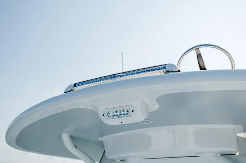  Yacht Photos Pics Close-up of 2019 Gamefisherman 26 Cuddy Cabin boat's helm and LED light.
