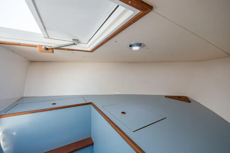  Yacht Photos Pics Interior of 2019 Gamefisherman 26 Cuddy Cabin with skylight and storage compartments.