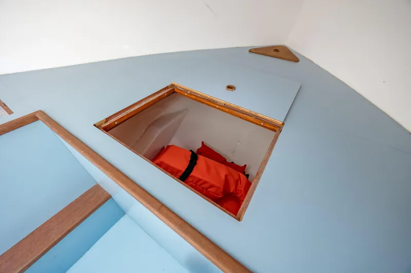  Yacht Photos Pics 2019 Gamefisherman 26 Cuddy Cabin interior storage compartment with life jackets.