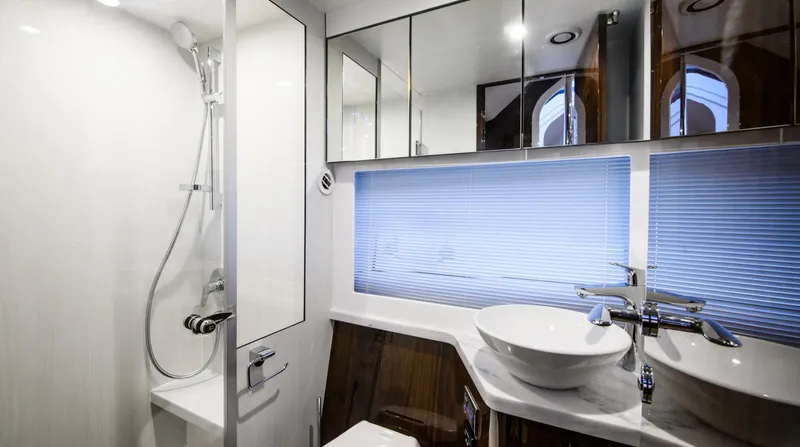  Yacht Photos Pics Luxurious bathroom in 2026 Fairline Targa 45 Open yacht with modern fixtures and elegant design.