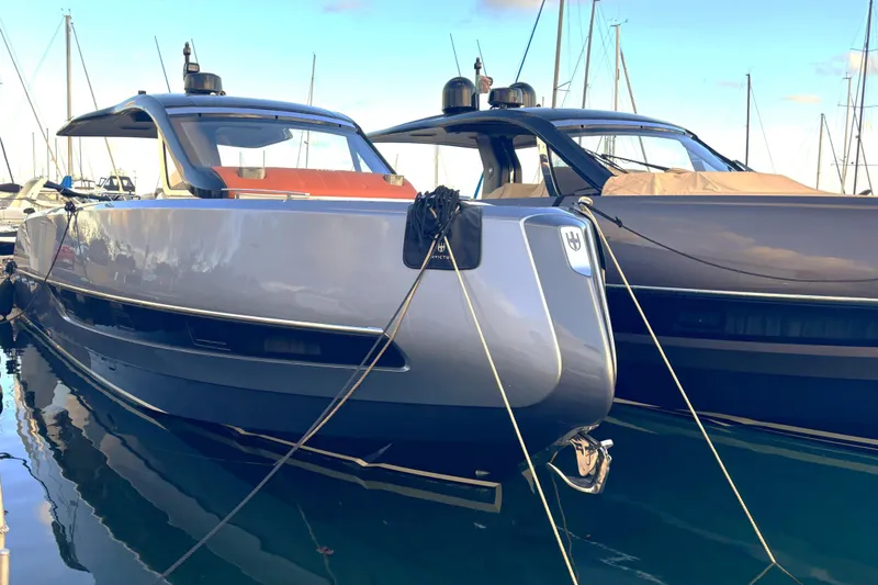  Yacht Photos Pics 2024 Invictus TT 420 yacht docked, sleek modern design.