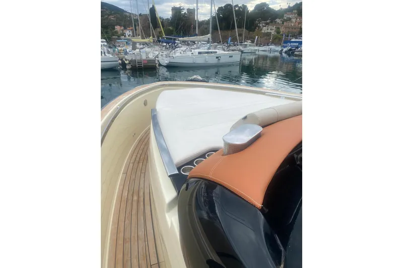  Yacht Photos Pics 2024 Invictus TT 420 yacht with sleek deck design in a marina setting.