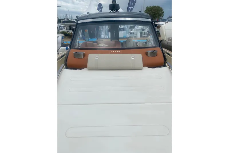  Yacht Photos Pics 2024 Invictus TT 420 luxury boat with sleek design and spacious deck.