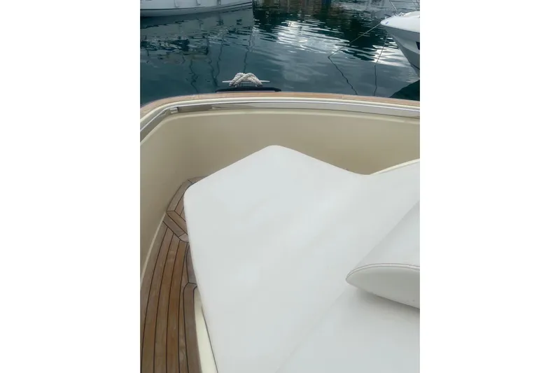  Yacht Photos Pics 2024 Invictus TT 420 boat with white seating and wooden deck detail.