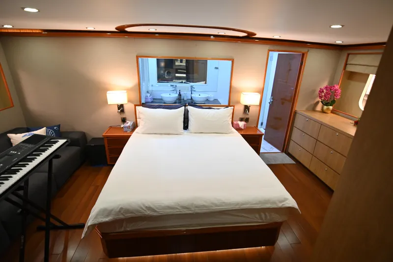  Yacht Photos Pics Luxurious bedroom on 2014 Accelera 82 yacht with double bed, keyboard, and elegant decor.