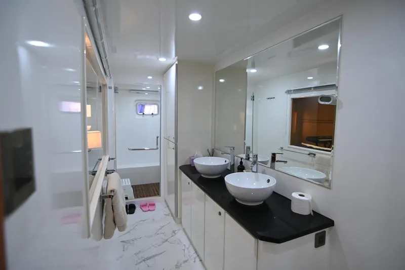  Yacht Photos Pics Luxurious bathroom interior on 2014 Accelera 82 yacht, featuring dual sinks and modern design.