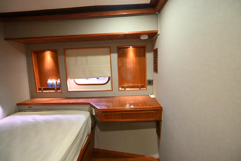  Yacht Photos Pics Luxurious cabin interior of 2014 Accelera 82 yacht with wooden furnishings and cozy bed.