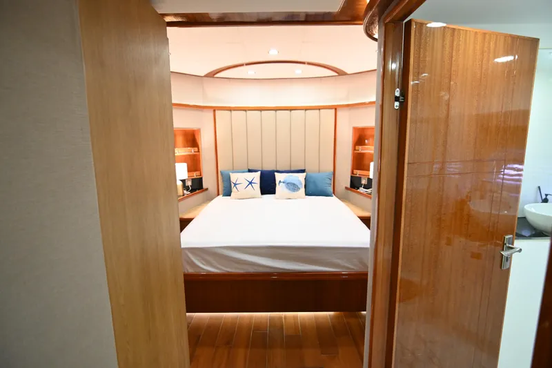  Yacht Photos Pics Luxurious bedroom interior on 2014 Accelera 82 yacht with elegant wood finishes and nautical decor.