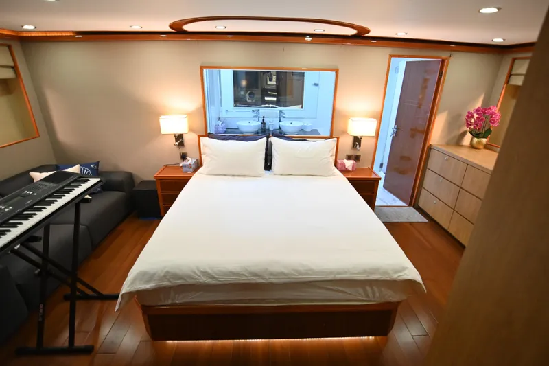  Yacht Photos Pics Luxurious bedroom on 2014 Accelera 82 yacht with keyboard, elegant decor, and modern amenities.