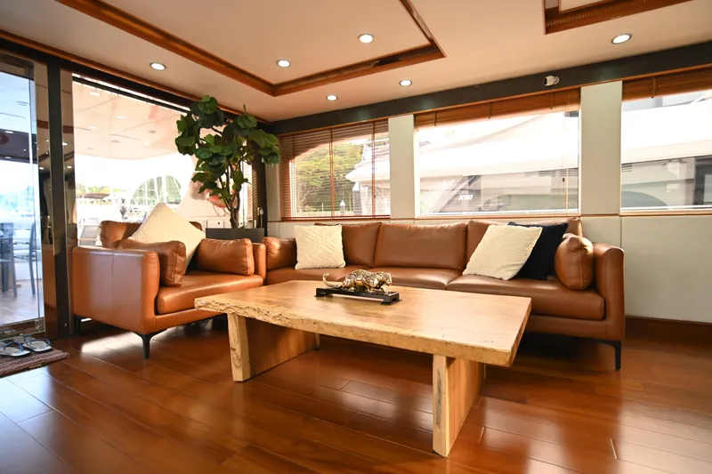  Yacht Photos Pics Luxurious yacht interior with leather sofas, wooden table, and large windows, Accelera 82, 2014.