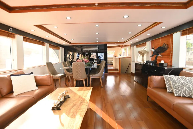  Yacht Photos Pics Luxurious interior of 2014 Accelera 82 yacht with elegant furnishings and wooden flooring.