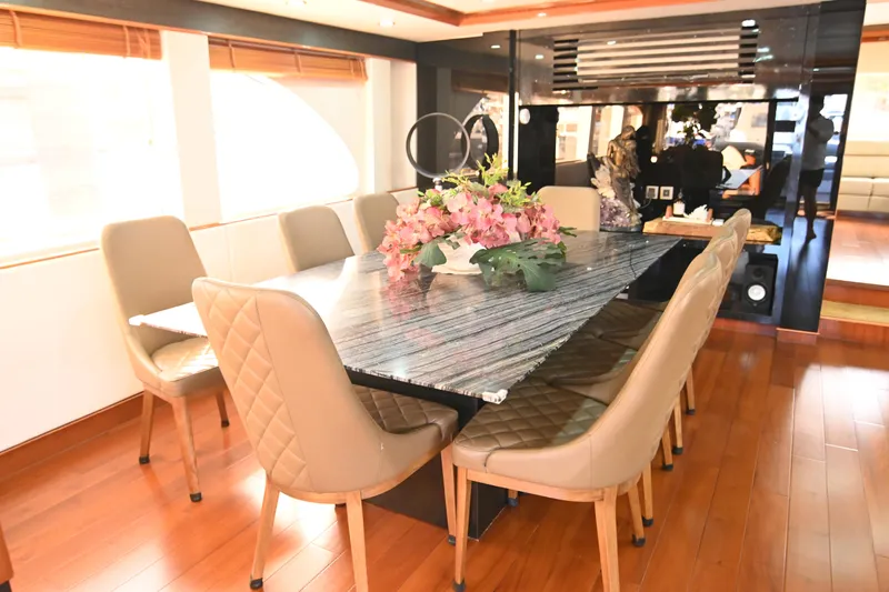  Yacht Photos Pics Luxurious dining area on 2014 Accelera 82 yacht with elegant table and chairs.