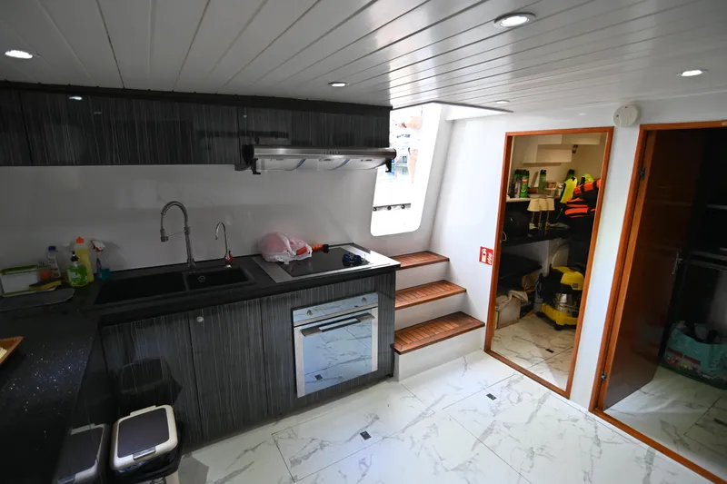  Yacht Photos Pics Modern kitchen interior on 2014 Accelera 82 yacht with sleek design and wooden accents.