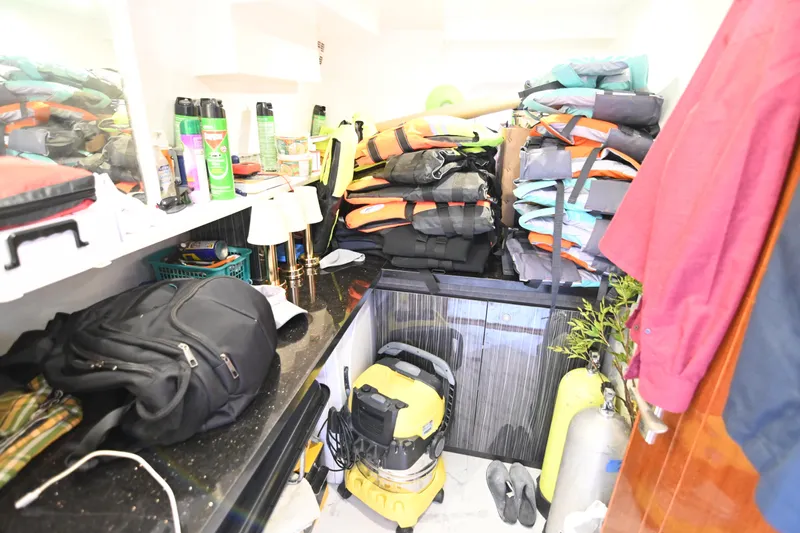  Yacht Photos Pics Storage room with life jackets, backpack, and cleaning equipment, Accelera 82, 2014.